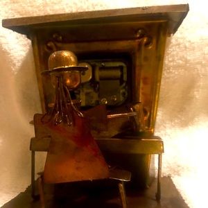 Vintage copper man playing piano music box . Works great